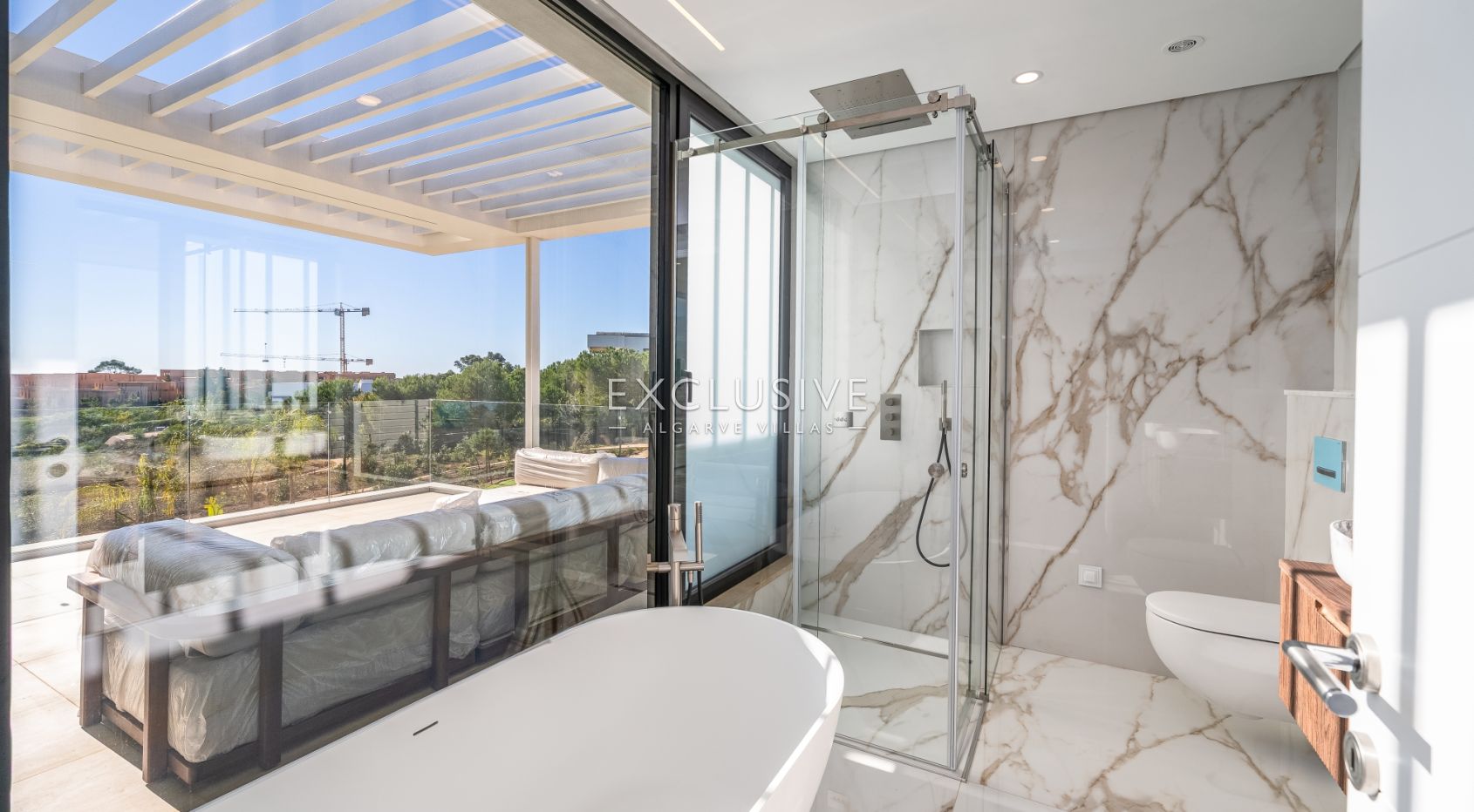 Buy 4 bedroom contemporary villa with golf and ocean views on Palmares golf course Lagos Algarve