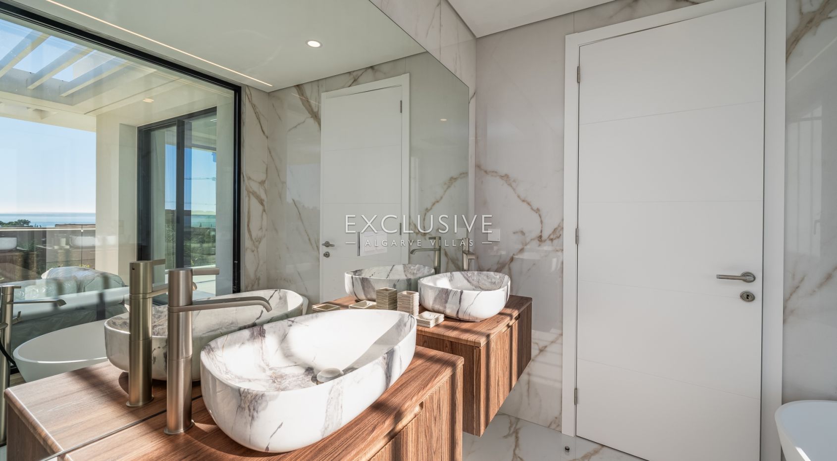 Buy 4 bedroom contemporary villa with golf and ocean views on Palmares golf course Lagos Algarve