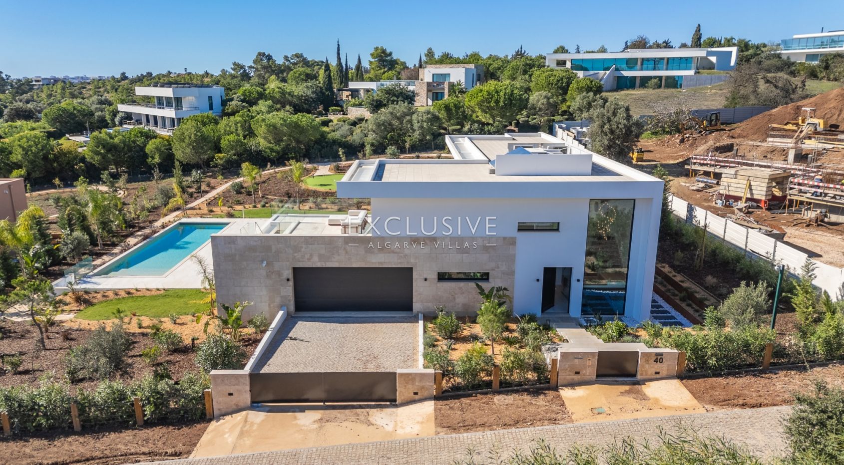 Buy 4 bedroom contemporary villa with golf and ocean views on Palmares golf course Lagos Algarve